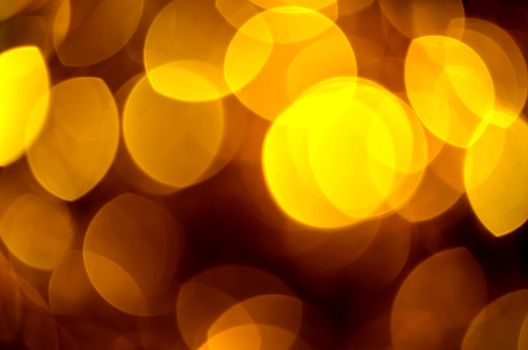 Blur golden circle lights as christmas background. 