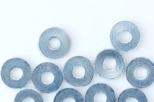 A lot of screw washers isolated on white background. 
