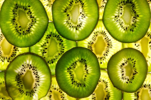 A lot of kiwi sheets as fruit background. 