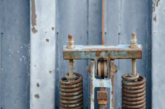 Detail of old blue rusty metal container. 