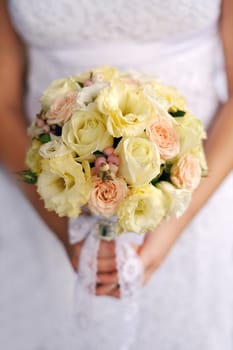 Bride holding beautiful wedding bouquet.