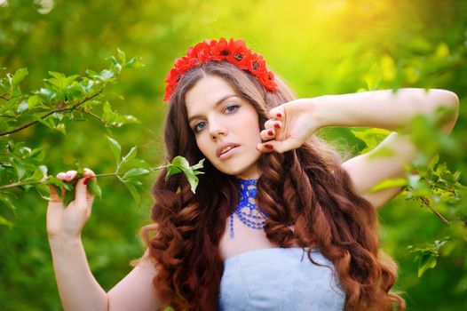 beautiful girl on a walk among the trees.