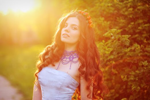 beautiful girl on a walk among the trees.