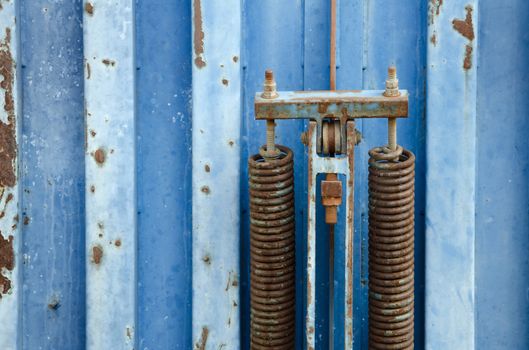 Detail of old blue rusty metal container. 