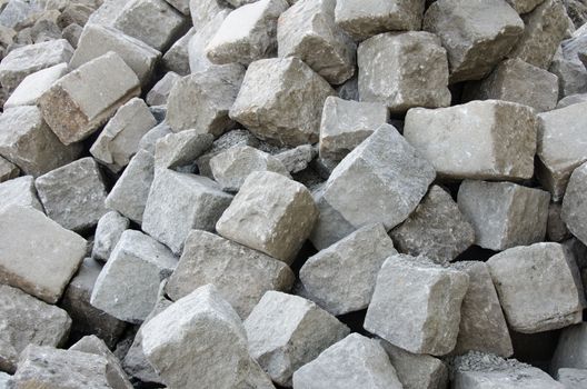 Dump of stone pavement blocks ready to use. 