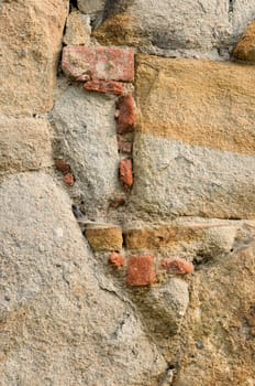 Very old downfallen brick wall of ancient building. 