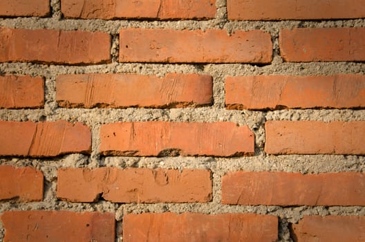 Very old downfallen brick wall of ancient building. 