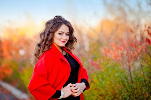 portrait of a fabulously beautiful girl in a red coat.
