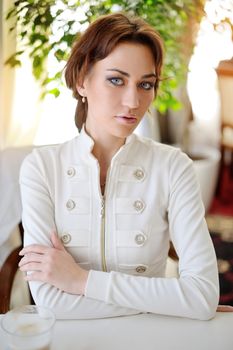 Beautiful woman with long brown hair. Closeup portrait of a fashion model.