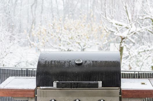 Barbecue grill in the winter on a balcony ready for winter grilling.