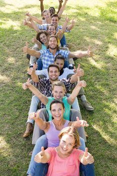 Happy friends in the park playing games on a sunny day