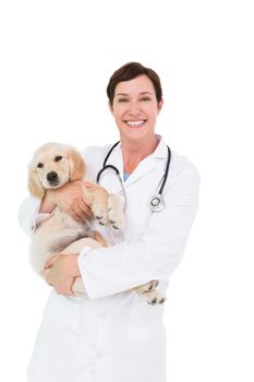Smiling veterinarian with a cute dog in her arms on white background 