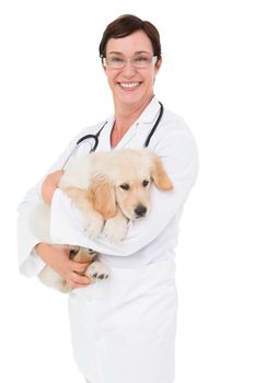 Smiling veterinarian with a cute dog in her arms on white background 
