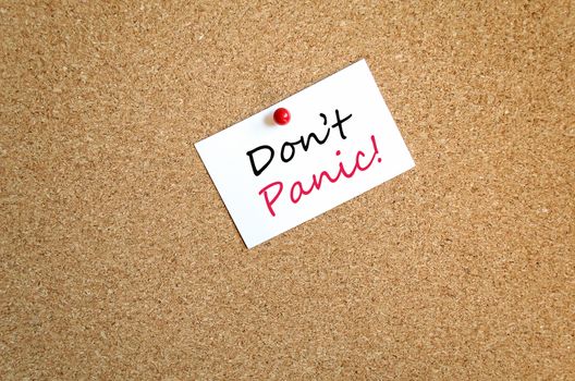 Sticky Note On Cork Board Background Don't Panic Concept