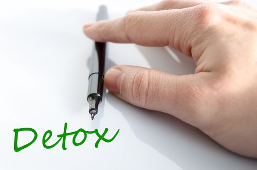 Pen in the hand isolated over white background detox concept