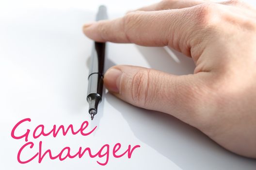 Pen in the hand isolated over white background game changer concept