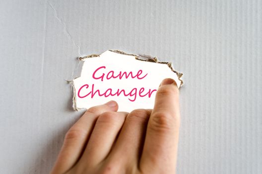 Hand on the cardboard background game changer concept