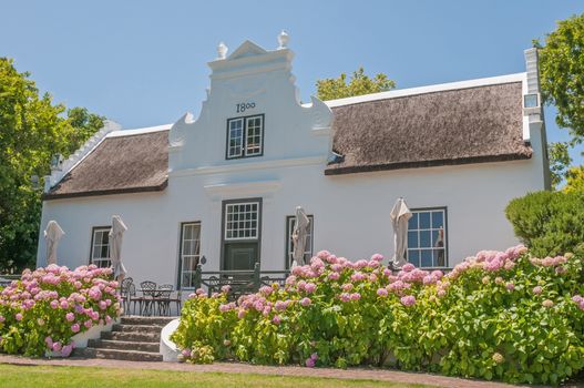 CAPE TOWN, SOUTH AFRICA - DECEMBER 15, 2014:  Restaurant in a historic building on the Zevenwacht Wine Estate near Bellville. The farm offers wine tasting a variety of dishes