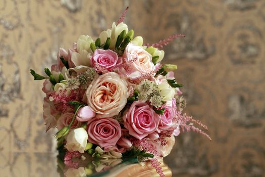 Wedding bouquet from roses on a abstract background