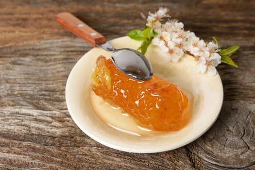 Honey in jar with honeycomb and wooden spoon