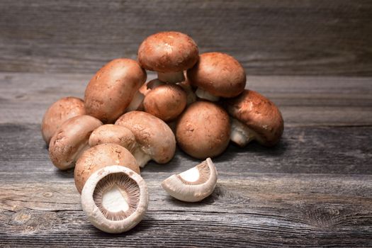 Brown champignon mushrooms on the table