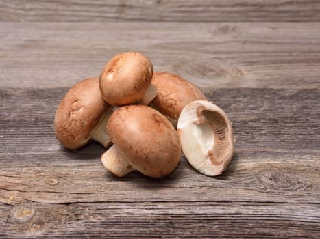 Brown champignon mushrooms on the table