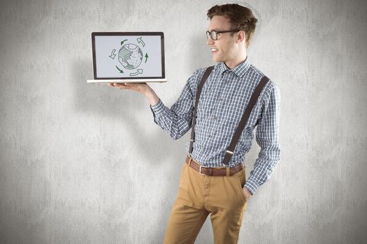 Geeky businessman showing his laptop against white background