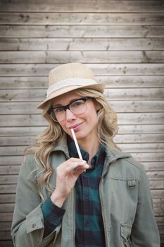 Pretty blonde against wooden planks background