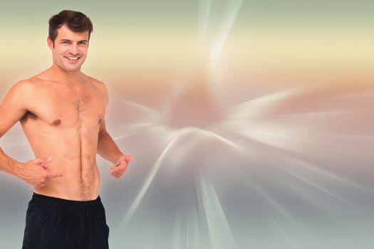Fit shirtless man smiling at camera against abstract background