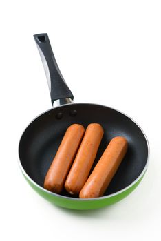 sausages fried in a pan