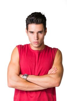 Serious looking young man wearing red t-shirt looking at camera isolated in white background