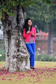 Chandigarh, India - January 4, 2015: Indian woman visit Zakir Hussain Rose Garden on January4, 2015 in Chandigarh, India. Zakir Hussain Rose Garden, is a botanical garden with 50,000 rose-bushes.