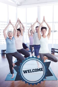The word welcome and class standing in tree pose at yoga class against badge