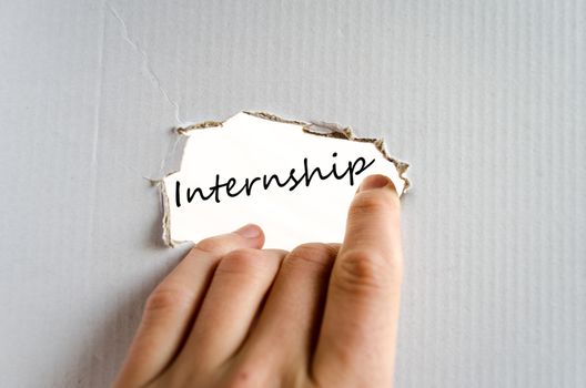 Hand on the cardboard background internship concept