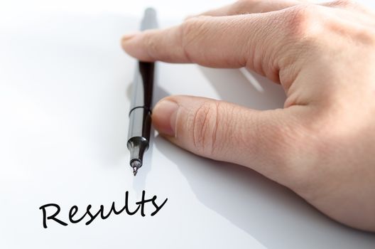 Pen in the hand isolated over white background results concept