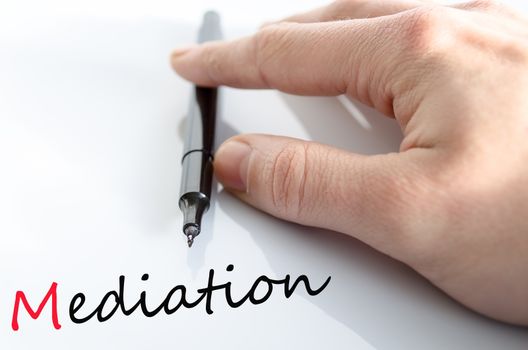 Pen in the hand isolated over white background mediation concept