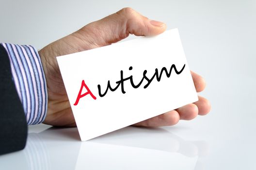 Business man hand writing autism