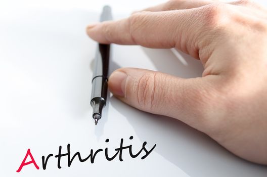 Pen in the hand isolated over white background arthritis concept