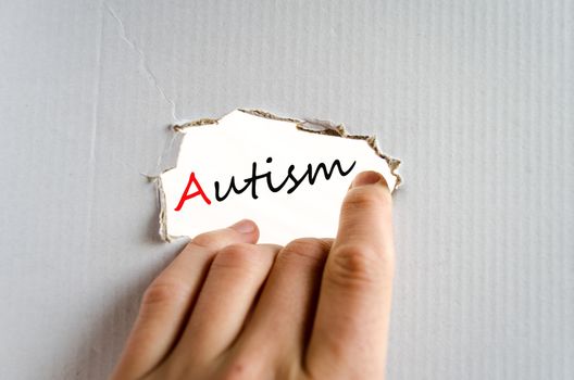 Hand on the cardboard background autism concept