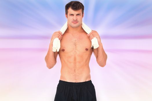 Fit shirtless man looking at camera against abstract background