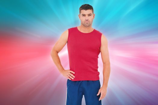 Fit man looking at camera against abstract background
