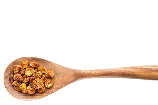 dried goldenberries on a wooden spoon isolated on white with a clipping path