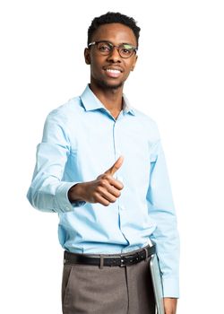 Happy african american college student with laptop and thumb up standing on white background