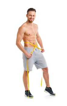 Athletic man with measuring tape on the white background