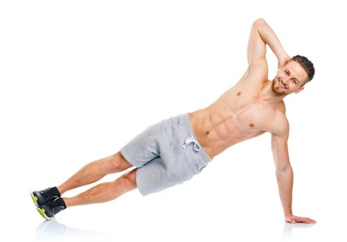 Sport attractive man doing fitness exercises on the white background