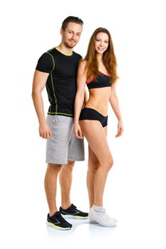 Athletic man and woman after fitness exercise on the white background