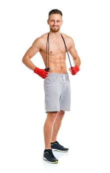 Athletic attractive man with a rope on the white background