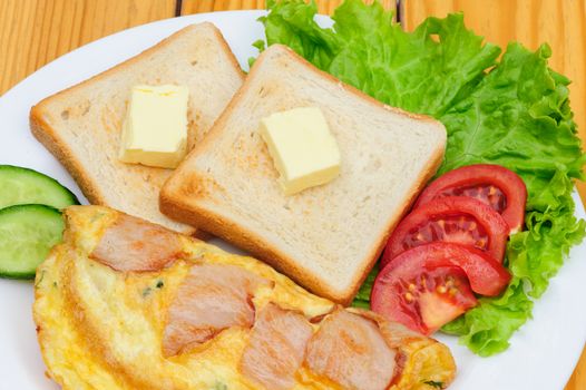 country omelette with bacon, salad and toasts