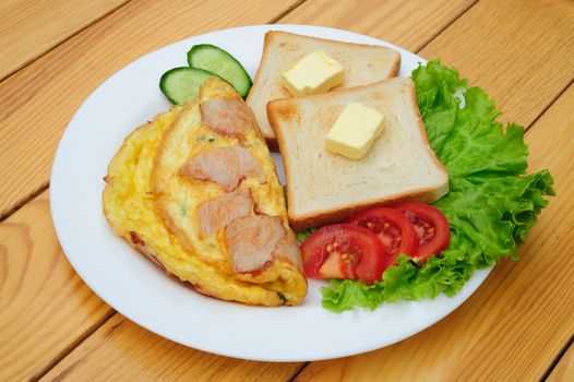 country omelette with bacon, salad and toasts