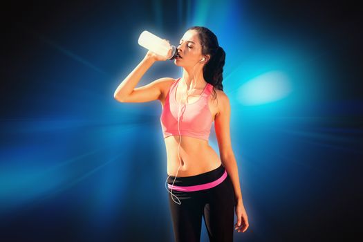 Beautiful healthy woman drinking water  against abstract background